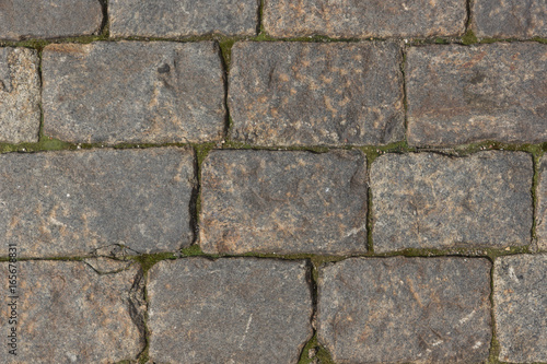 Ancient paving road in the center of the city close up