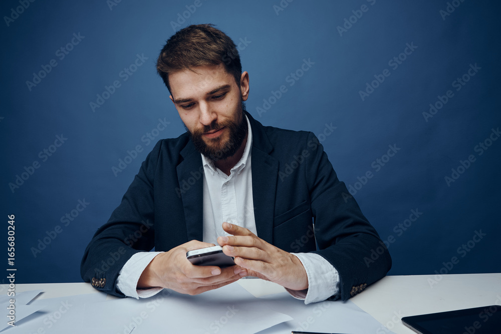 Business man with a beard working at his desk in the office Business man with a beard working at his desk in the office