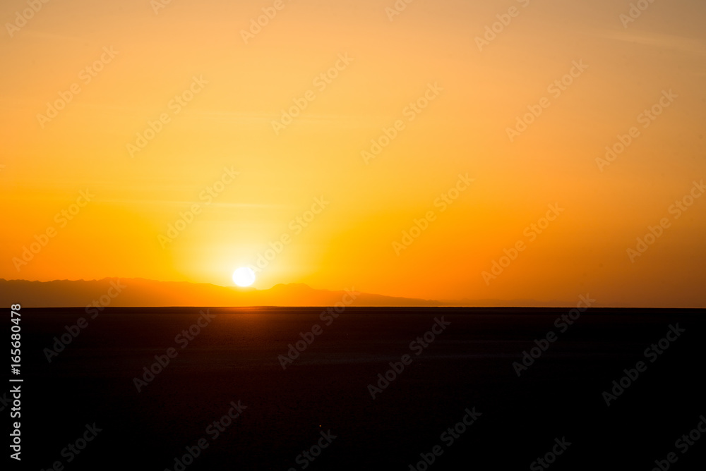 Sunset or sunrise over the Sahara Desert