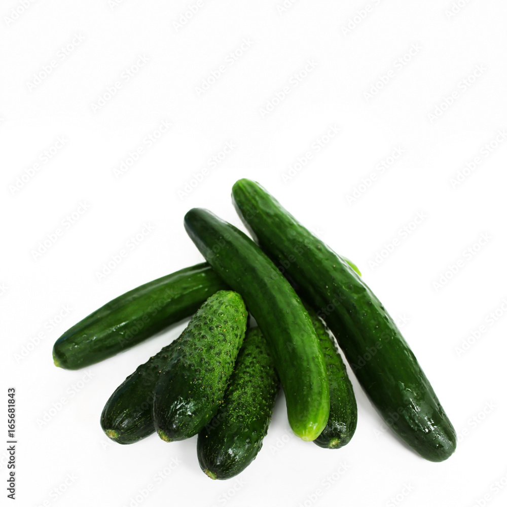 Fresh green cucumbers isolated on white background. Fresh green cucumbers isolated on white background.