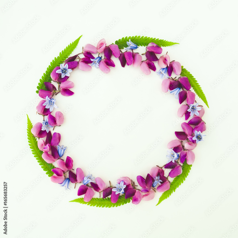 Flowers composition. Wreath made of various colorful flowers on white background. Easter, spring, summer, minimal concept. Flat lay, top view