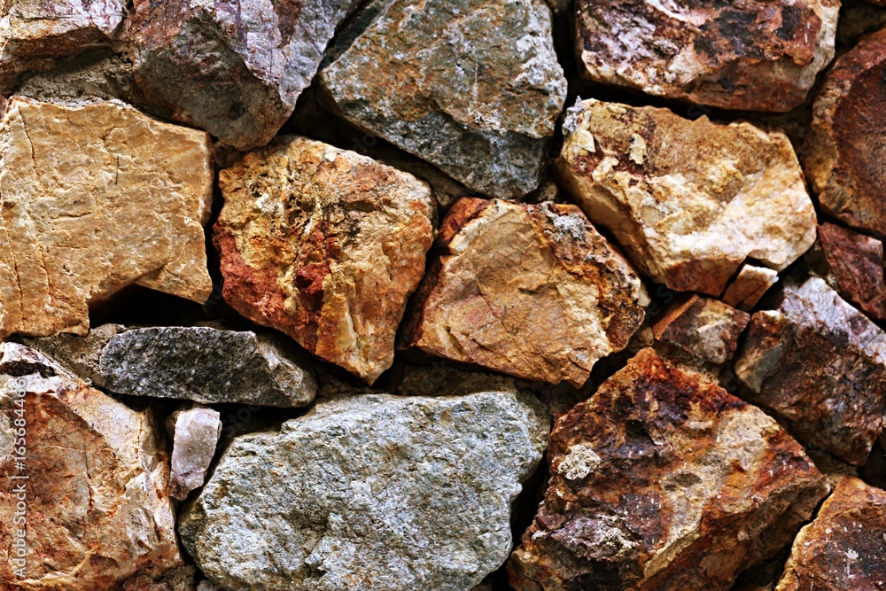 Rough rocks wall texture background. Brown stone wall texture background Rough rocks wall texture background. Brown stone wall texture background