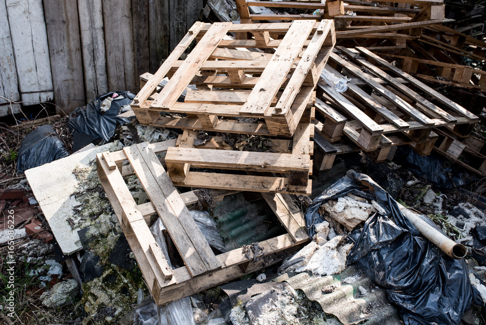 abandoned pallets on a landfill in disrepair abandoned pallets on a landfill in disrepair
