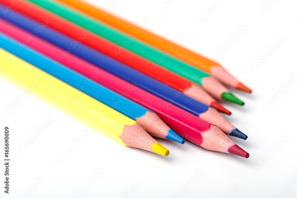 Color pencils isolated on white background. Many different colored pencils. Colored drawing pencils in a variety of colors Color pencils isolated on white background. Many different colored pencils. Colored drawing pencils in a variety of colors