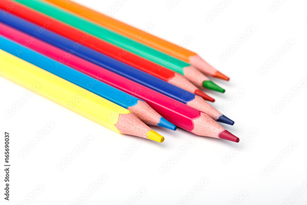 Color pencils isolated on white background. Many different colored pencils. Colored drawing pencils in a variety of colors Color pencils isolated on white background. Many different colored pencils. Colored drawing pencils in a variety of colors