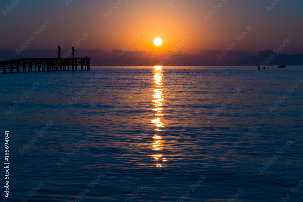 Panorama of sunset or sunrise on the calm sea Panorama of sunset or sunrise on the calm sea