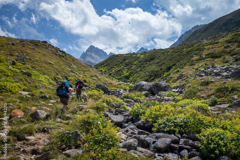 Two unidentified hikers with large backpacks hiking on mountain Kackarlar. Kackar Mountains are a mountain range that rises above the Black Sea coast in eastern Turkey