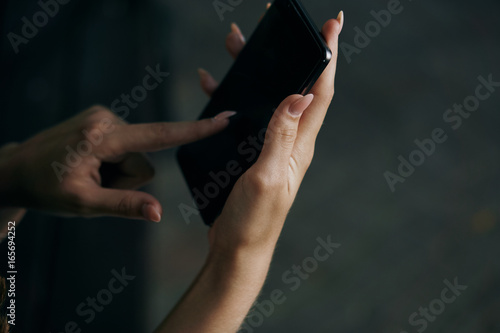 Woman is holding a phone, technology, smartphone