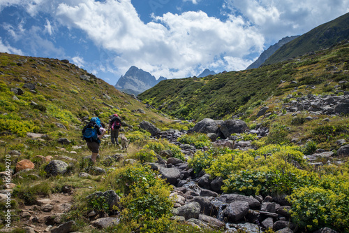 Two unidentified hikers with large backpacks hiking on mountain Kackarlar. Kackar Mountains are a mountain range that rises above the Black Sea coast in eastern Turkey