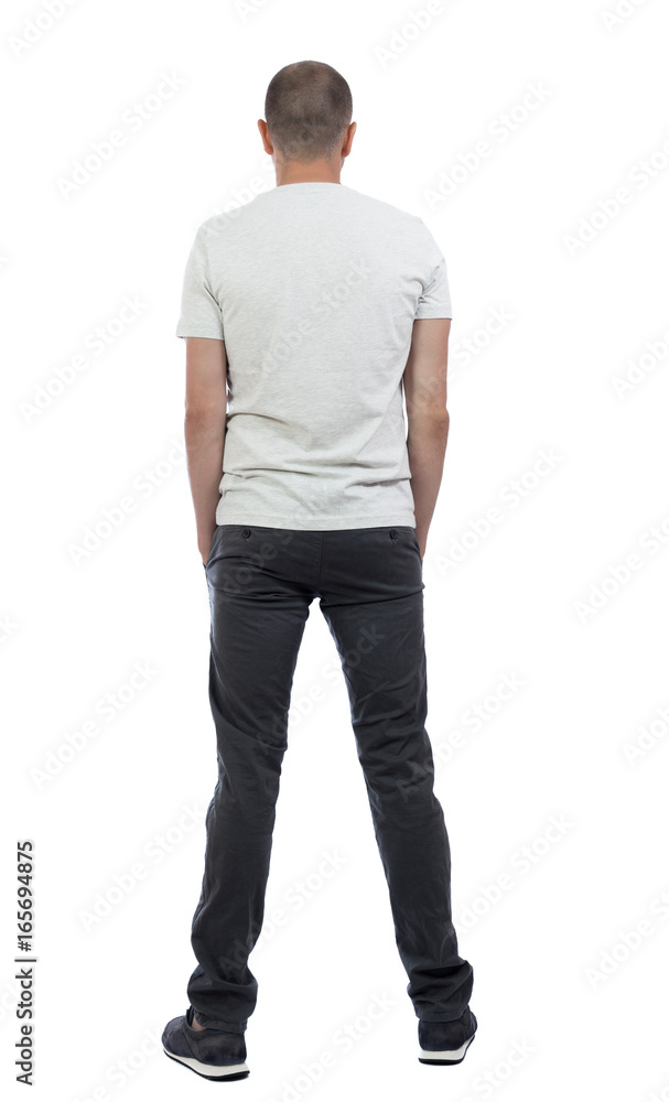 Back view of man in trousers. Standing young guy. Rear view people collection. backside view of person. Isolated over white background. Back view of man in trousers. Standing young guy. Rear view people collection. backside view of person. Isolated over white background.