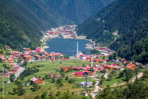 Uzungol(Long Lake):One of the most beautiful tourist places in Turkey.The mountain valley with a trout lake and a small village in Trabzon,Turkey. photo