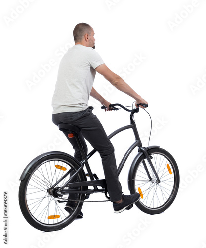 back view of a man with a bicycle. cyclist rides a bicycle. Rear view people collection. backside view of person. Isolated over white background.