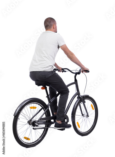 back view of a man with a bicycle. cyclist rides a bicycle. Rear view people collection. backside view of person. Isolated over white background.