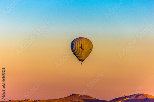 Colorful hot air balloons flying over the valley at Cappadocia,Anatolia,Turkey.The great tourist attraction of Cappadocia best places to fly with hot air balloons.NEVSEHIR/TURKEY- JULY 23,2016 © epic_images