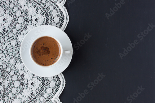 Turkish coffee on a lace and black background photo