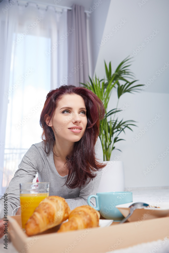Beautiful happy woman having breakfast in bed Beautiful happy woman having breakfast in bed