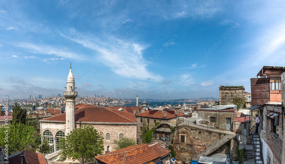 ISTANBUL, TURKEY - MAY 05, 2017:View of galata tower from roof of  Buyuk Valide Han an old Ottoman inn that accommodated traveling merchants over 350 years ago