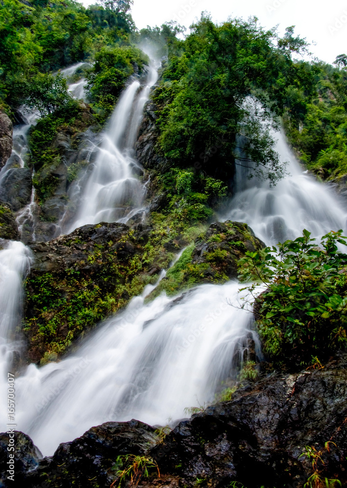 Fototapeta premium Nature landscape of waterfall hidden in the tropical, Thailand