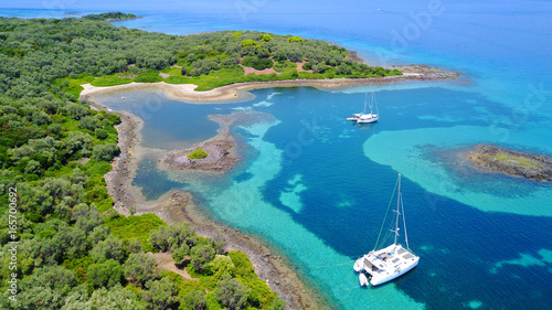 Aerial drone photo of Monolia island exotic beach with sapphire and turquoise clear waters, called the "Seychelles" of Greece, Lihadonisia island complex, North Evoia gulf, Greece