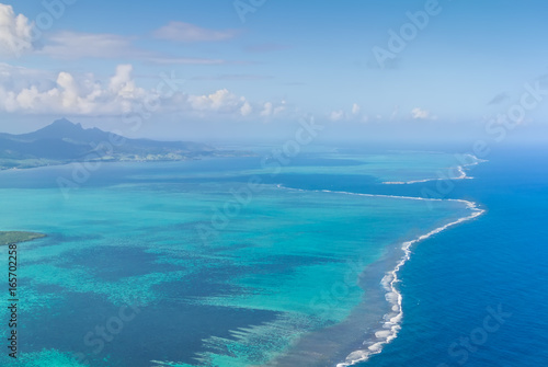 Aerial picture of the southeast, south east coast of Mauritius Island. Beautiful lagoon and reef barrier of Mauritius Island shot from above.