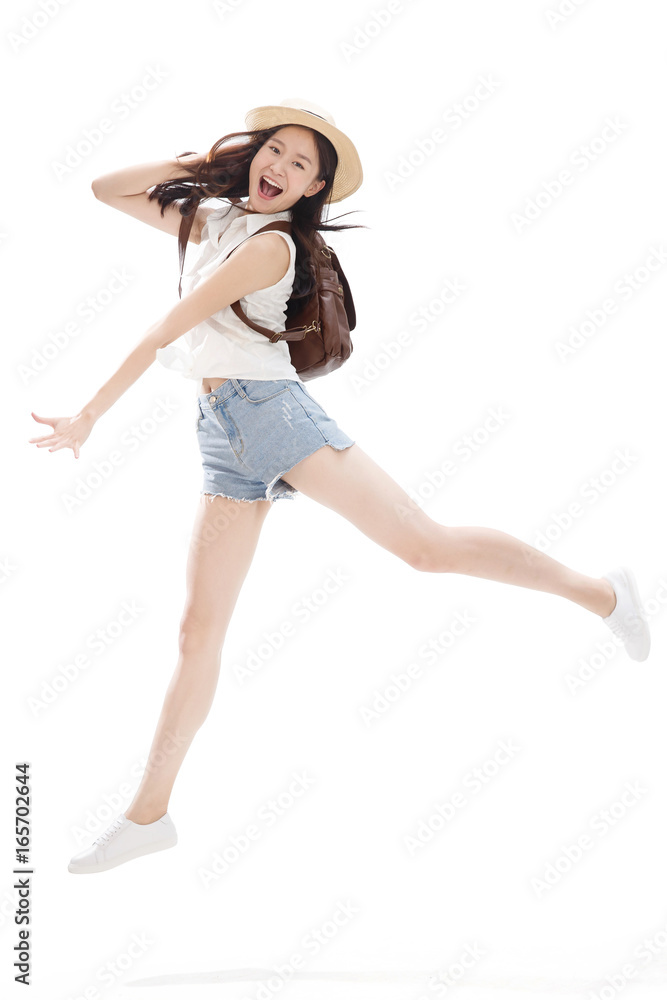 Portrait of young woman jumping in air Portrait of young woman jumping in air