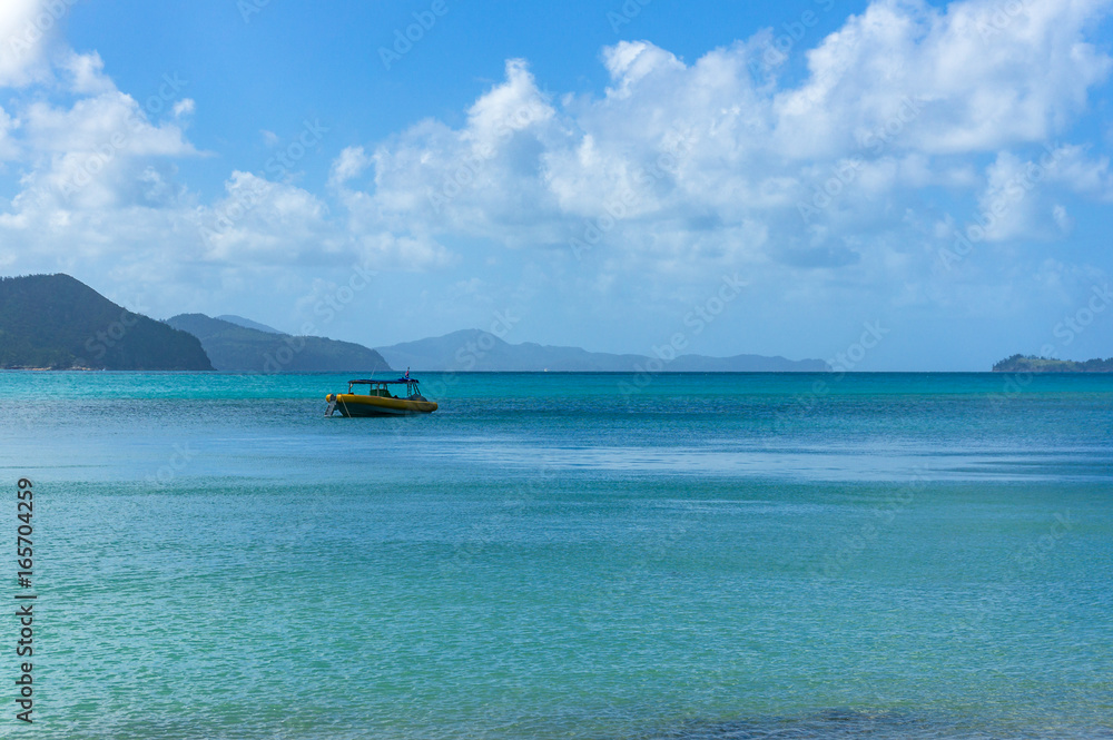 Fototapeta premium Boat in beautiful lagoon surrounded by mountains