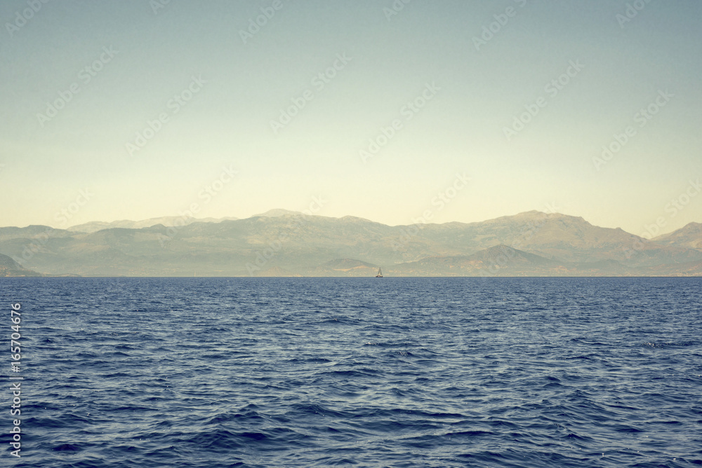 sea, mountains landscape, sailboat sailing far from seashore sea, mountains landscape, sailboat sailing far from seashore