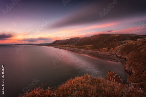 Sunset at Rhossili Bay at the far tip of the Gower peninsula  South Wales  UK
