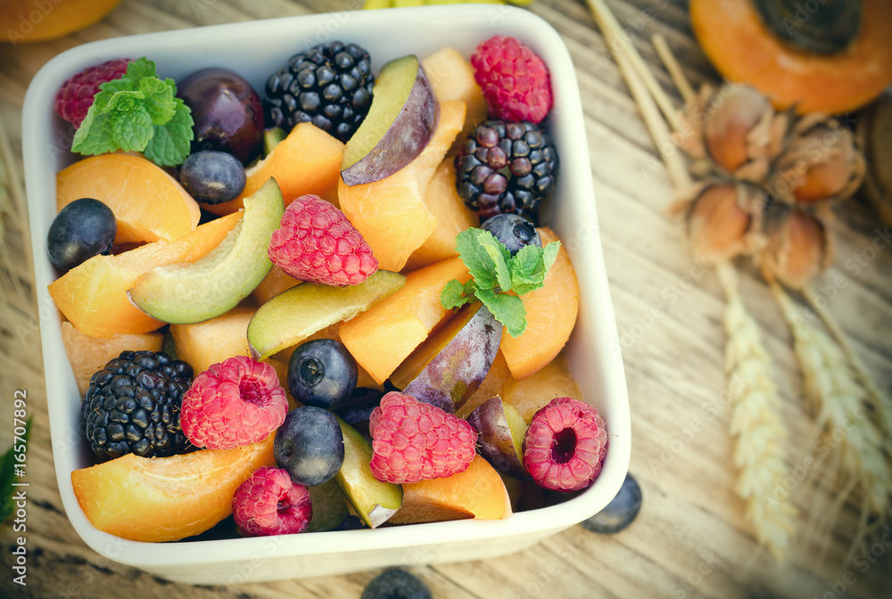 Fruit salad with fresh organic fruit in bowl - healthy eating healthy food Fruit salad with fresh organic fruit in bowl - healthy eating healthy food