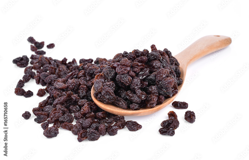 Dried Grapes into a spoon isolated in white background Dried Grapes into a spoon isolated in white background
