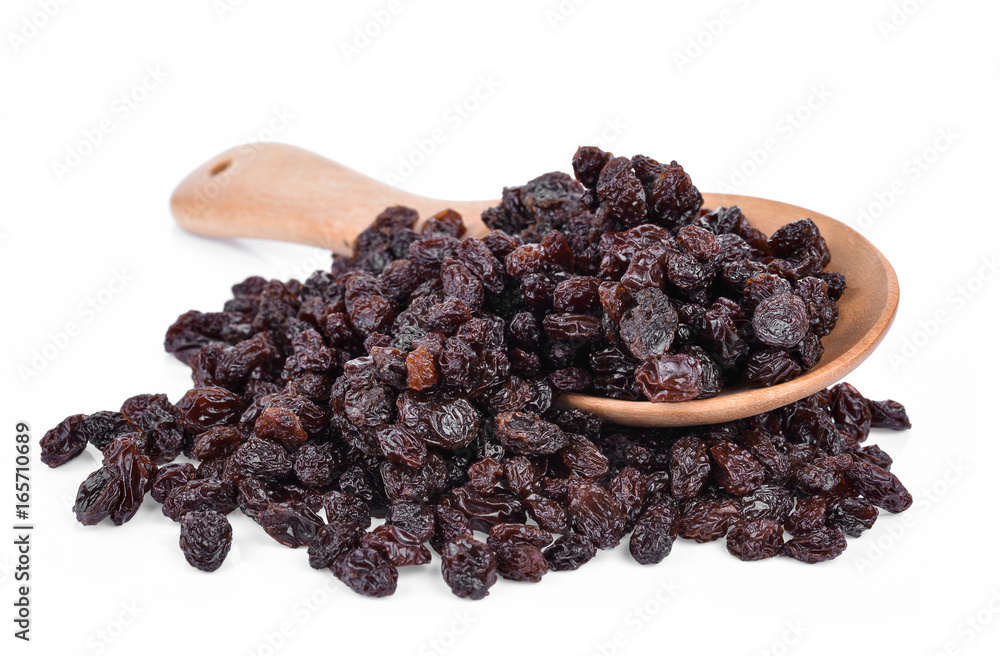 Dried Grapes into a spoon isolated in white background Dried Grapes into a spoon isolated in white background