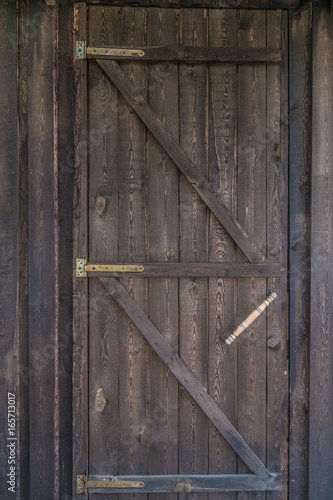 Countryside aged old farm barn door closeup