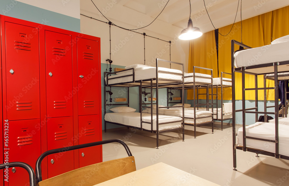 Interior of the students hostel with modern bunk beds and locker for personal things - obrazy, fototapety, plakaty 
