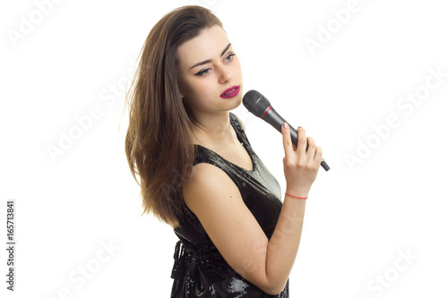 young lady in black dress with microphone