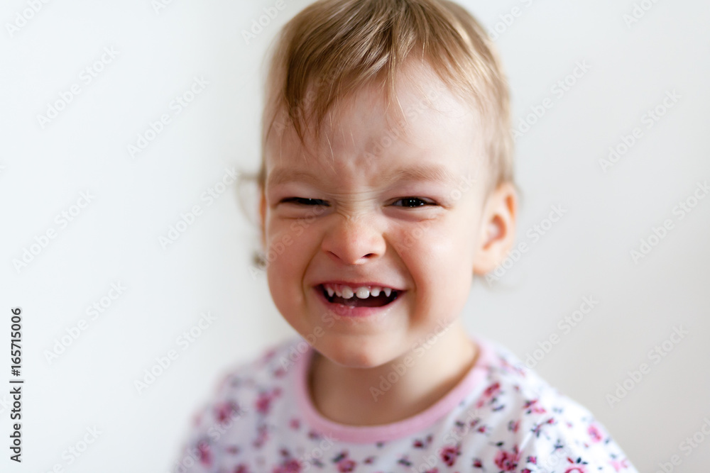 2 years old girl child is doing facial expressions 2 years old girl child is doing facial expressions