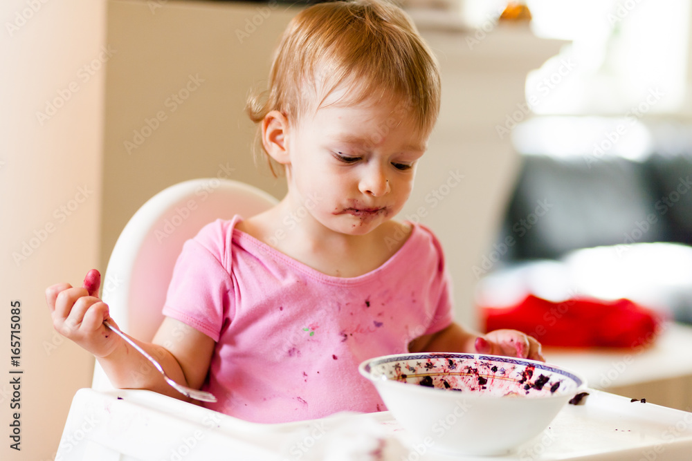 2 years old girl child is eating