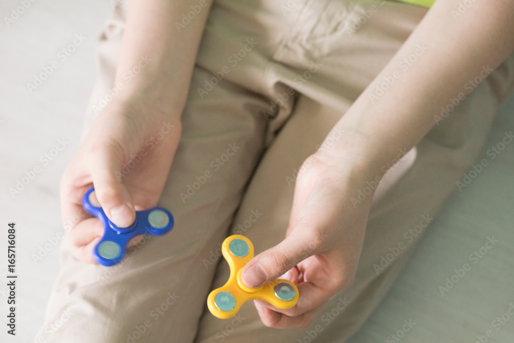 Man playing with spiners. Top view Stock photo Man playing with spiners. Top view Stock photo