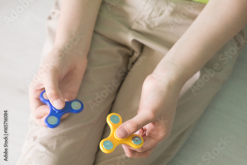 Man playing with spiners. Top view Stock photo