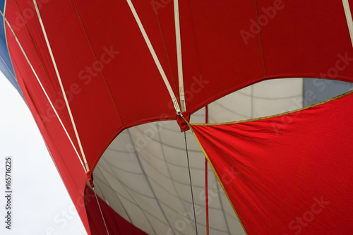 Part of a vivid red and white balloon close-up. Modern background for bright moments of life and adventure