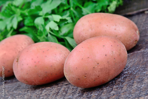 Red potatoes with parsley on table