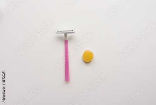 Tool, instrument for hair depilation: razor and sugaring on a white background. Top. Close-up. Stock photo