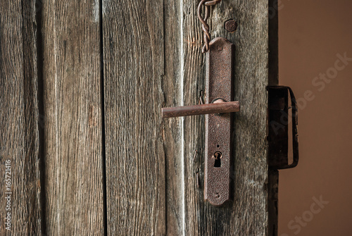 Old dried wood doors with rusty lock