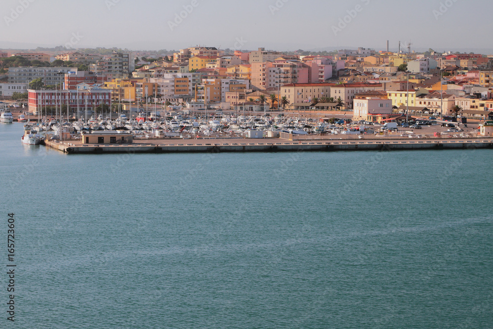 Sea, yacht port and city. Porto-Torres, Italy