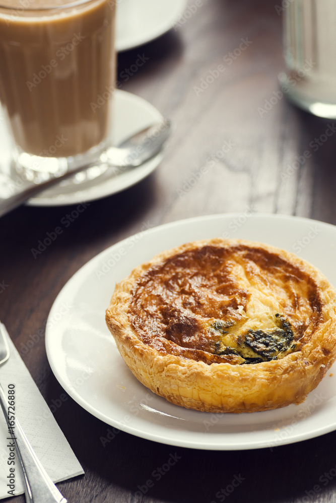 Continental Breakfast: Mini Cheese and Spinach Quiche with Latte in European Cafe Continental Breakfast: Mini Cheese and Spinach Quiche with Latte in European Cafe
