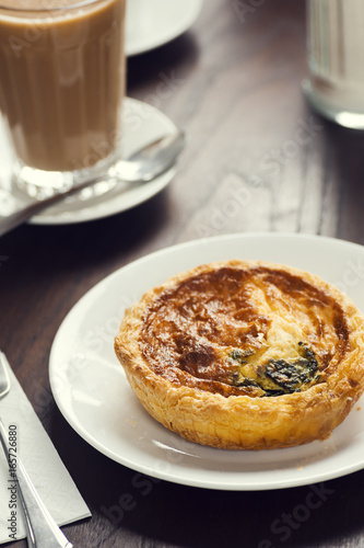 Continental Breakfast: Mini Cheese and Spinach Quiche with Latte in European Cafe 