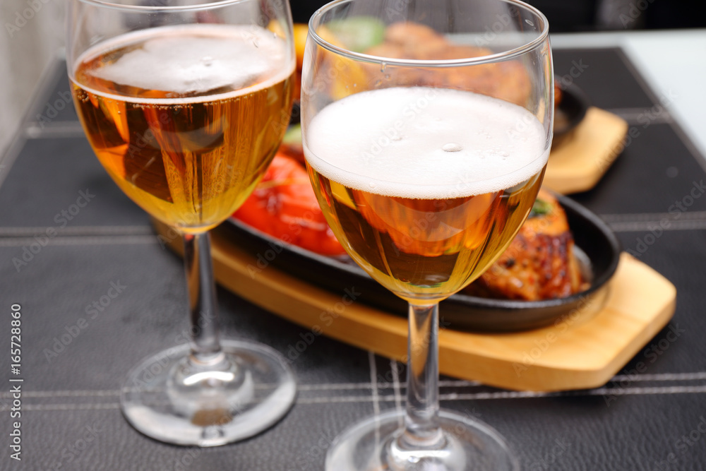 two beer glass and food background two beer glass and food background