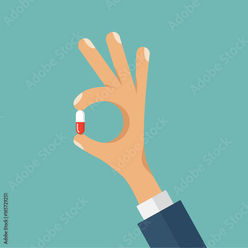 Vector concept flat style illustration of human hand holding the medicine pill between fingers.