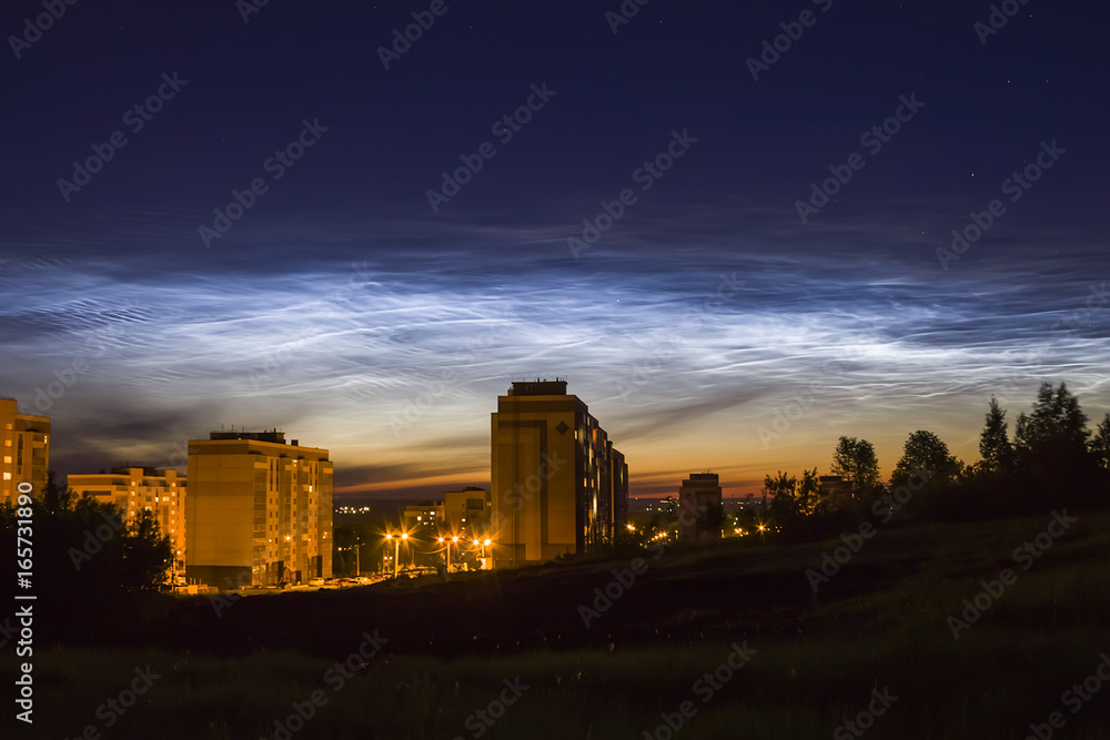 Noctilucent clouds in the night sky