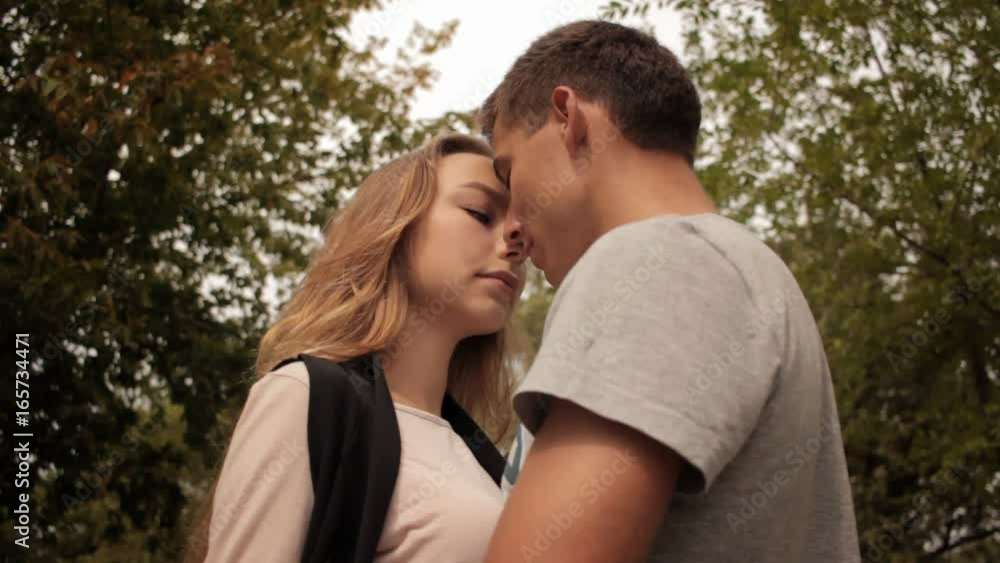 Loving couple kissing in summer Loving couple kissing in summer