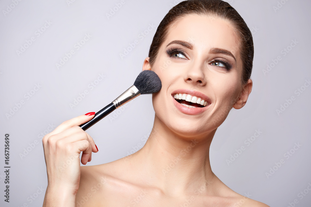 Beauty Girl with Makeup Brushes. Make-up for Brunette Woman. Beauty Face with smile Beauty Girl with Makeup Brushes. Make-up for Brunette Woman. Beauty Face with smile